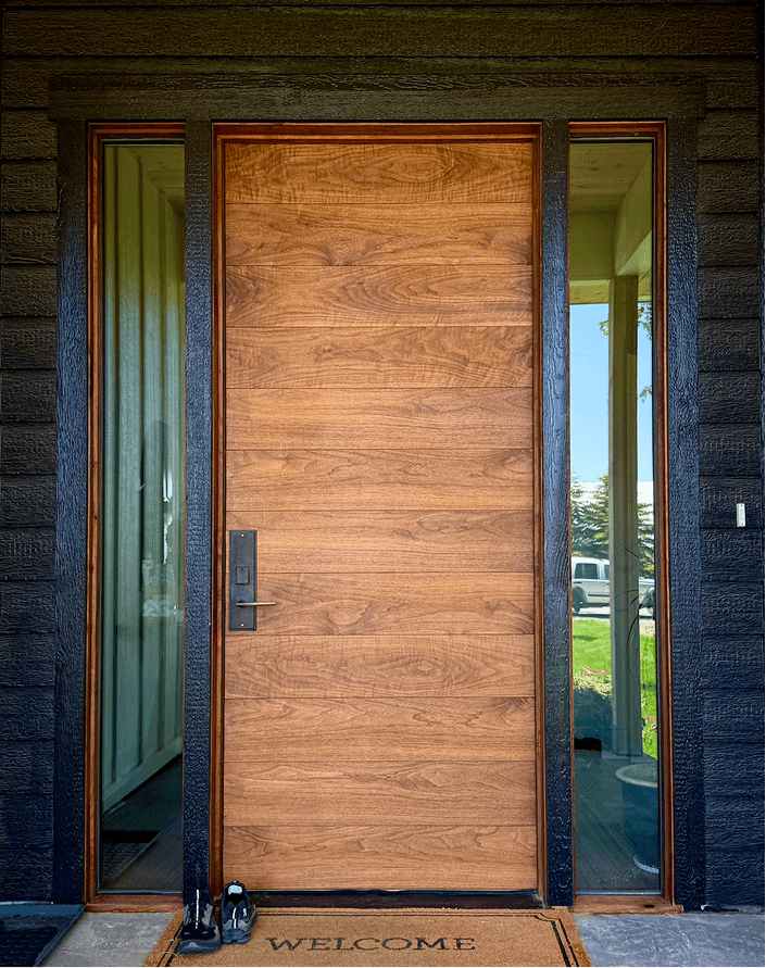 Custom hardwood entry door with architectural detailing